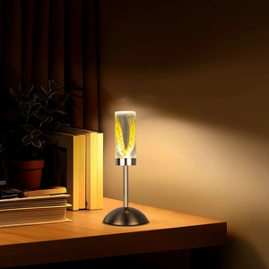 Detail view of acrylic night lamp with golden wheat pattern on wooden table