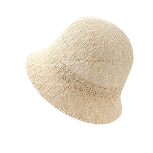 Women's cream white hollow knit bucket hat featuring delicate crochet wave patterns