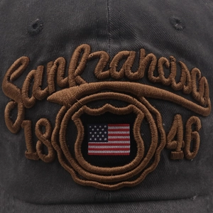 Detailed close-up of 1846 San Francisco embroidery and American flag on washed cotton cap