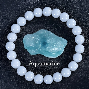 Macro detail of natural aquamarine bracelet featuring raw stone and polished blue beads