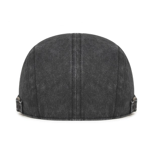 Vintage washed denim docker cap with adjustable metal buckles on a white background