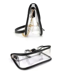 Transparent PVC saddle crossbody bag with black trim and gold chain strap in minimalist style