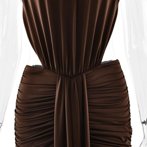 Detailed view of the draped waist and pleated fabric on this elegant brown evening dress