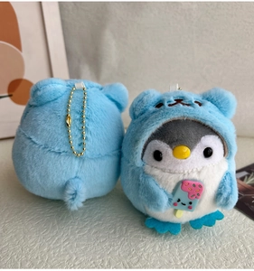 Detailed front and back view of blue plush penguin keychain holding a pink ice cream cone