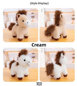 Detail view of cream and white plush pony toys showing soft texture and brown manes