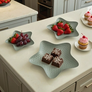 Star-shaped nordic metal snack trays with hammered texture in elegant morandi green finish