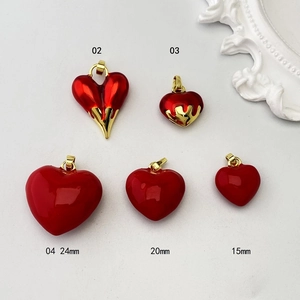 Set of five red heart-shaped enamel charms with gold trim in various sizes for DIY jewelry