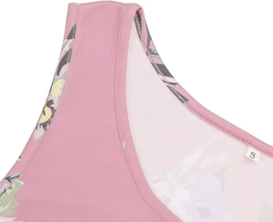 Close-up of pink floral maternity dress neckline and strap showing fabric texture
