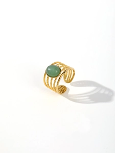 Macro detail of 18k gold plated stainless steel ring with green malachite stone inlay