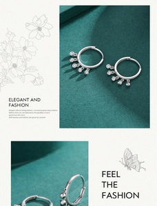 Detail of silver S925 hoop earrings with small round cubic zirconia charms on teal background