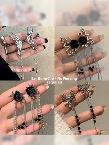Detail of silver long tassel ear cuffs with black rose and butterfly, no piercing needed