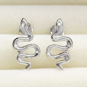 Close-up of S925 sterling silver snake earrings with pavé cubic zirconia and shiny finish