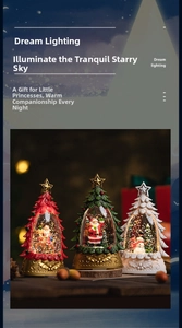Close-up of three LED Christmas tree snow globes with Santa and reindeer figurines