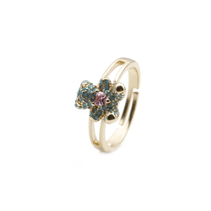 Golden bear ring with blue stones and pink heart gem on a clean white background