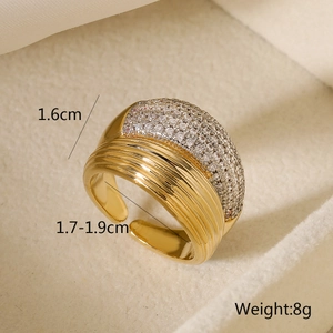 Detailed view of gold wide band ring with pave-set rhinestones and size measurements