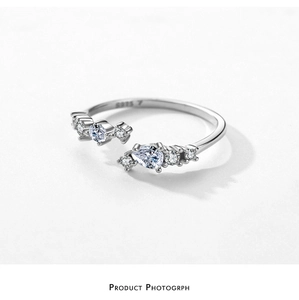 Macro shot of S925 sterling silver ring with sparkling marquise and round zircon stones