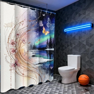 Detail of artistic shower curtain featuring a mystical sun, moon, and forest landscape pattern