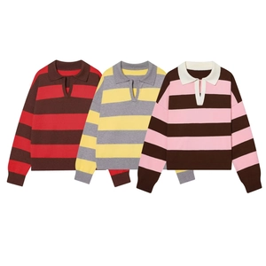 Close-up showing striped polo knit sweaters in red, yellow, and pink colors