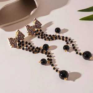 Leopard print bow earrings with long gold chain tassels and black glass beads