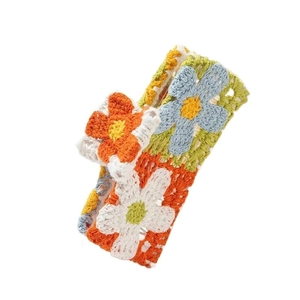 Handmade crochet floral hair claw clip with colorful knitted flowers for beach vacations