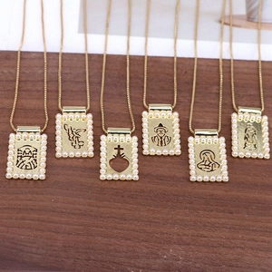 Detailed macro view of six gold necklaces featuring hollow pendants with pearl borders