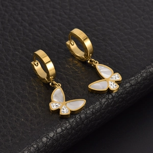 Elegant gold butterfly dangle earrings with white shell inlay and micro-pave crystals