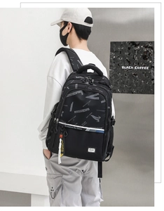 Detail of a large capacity travel backpack with 'To explore the future' printed slogan