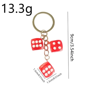 Creative resin dice keychain with three red dice and white dots on a metal ring
