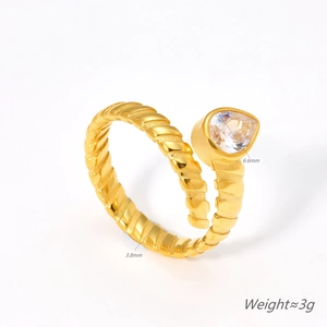Water drop gold ring with spiral band and pear-shaped zircon stone on white background