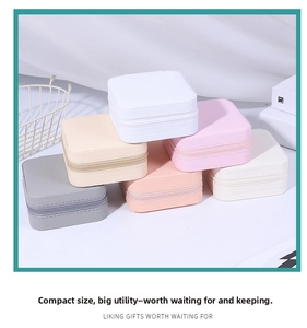Detail of colorful square PU leather jewelry travel boxes with textured finishes