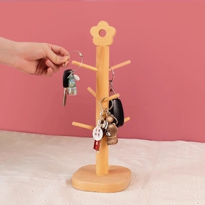 Solid wood tree-shaped key organizer with multiple hooks and stable square base for desktop