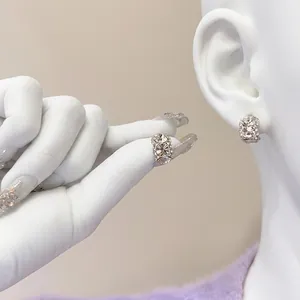 Close-up of sparkling s925 silver stud earrings with multi-stone pavé zircon setting