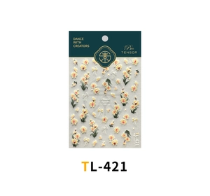 Detail of TL-421 floral nail stickers featuring yellow flowers and white bows on packaging