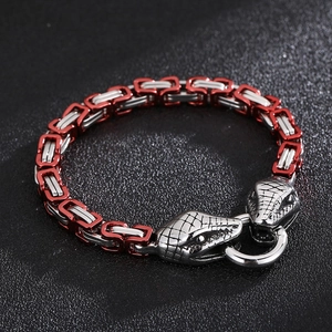 Detail of red and silver Byzantine chain bracelet with dual snake head clasps