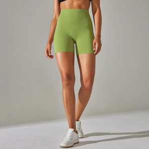 Detail view of the high-waist grass green yoga shorts and its breathable fabric
