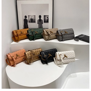 Detail of woven crossbody bags in multiple colors with golden knot-shaped metal clasps