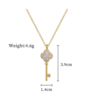 Detail view of lucky clover key pendant with rhinestones and measurement annotations