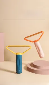 Detail of portable pet hair scrapers with dual-color design and standing storage base