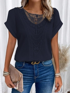 Detail of V-neck short sleeve top featuring intricate lace trim and waffle knit texture