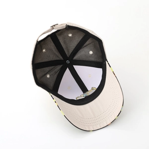 Interior view of breathable beige kids baseball cap with mesh lining and metal buckle