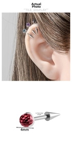 Detail view of F136 titanium earring featuring a 4mm red zircon and sharp spike end