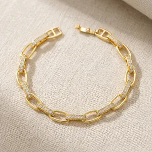 7mm gold-plated brass link chain bracelet with micro-pave cubic zirconia accents