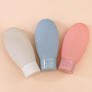 Three-piece 60ml soft silicone travel bottle set for shampoo in gray, blue, and pink colors