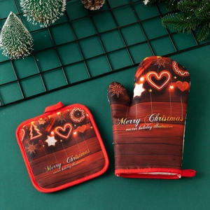 Detailed view of red Christmas oven mitt and pot holder with heart pattern
