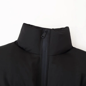 Women's black quilted puffer jacket with stand collar and zipper closure details
