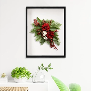 Close-up of 3D floral shadow box frame with red flowers and pine cones for DIY wall decor