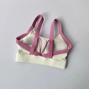 Detail of yoga sports bra with honeycomb breathable pads and purple cross back straps