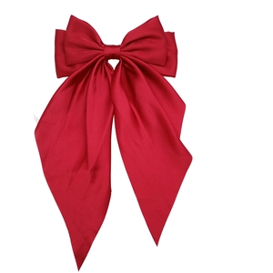Elegant red satin oversized bow hair clip with a vintage aesthetic for women's hair styling