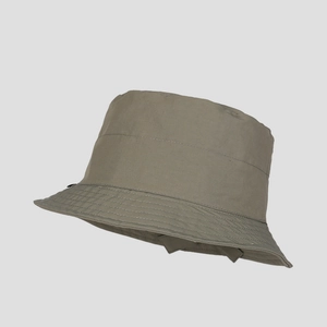 Detail of olive green nylon bucket hat showing parallel stitching on a structured brim