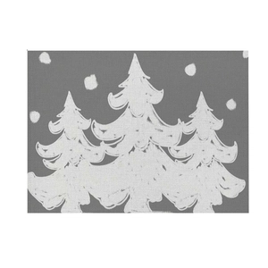 Close-up of grey Christmas placemat with white festive tree prints and linen texture
